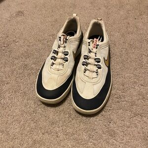 Nike Cream and Black Sneakers with Gold Accents